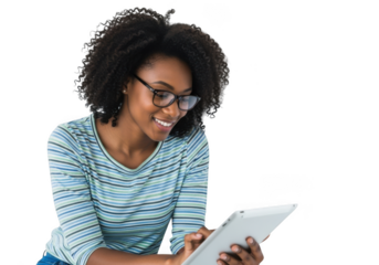 Young african american woman with curly hair and glasses wearing a striped shirt, smiling while looking at a tablet computer, isolated on transparent background