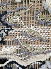 Background of a carpet made of crochet in a museum.