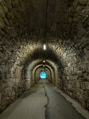 light at the end of the tunnel abstract concept that that a difficult or long-lasting period of hardship is finally coming to an end and that a better situation is approaching