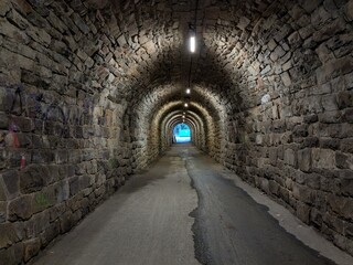 Obraz premium light at the end of the tunnel abstract concept that that a difficult or long-lasting period of hardship is finally coming to an end and that a better situation is approaching 