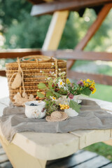 Delicate Floral Arrangement and Berries on a Rustic Table Setting