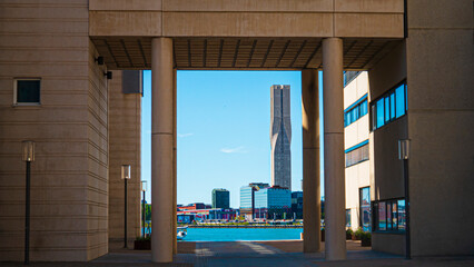 skyscraper by the harbor; under a passageweay