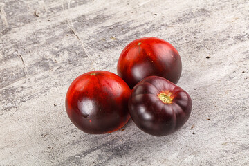 Black ripe juicy organic tomato