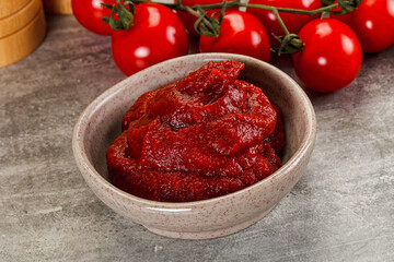 Red tomato paste in the bowl