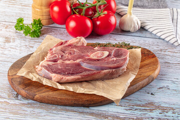 Raw lamb steak with bone