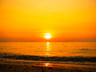 Fototapeta premium Sea sunset sky evening sunrise cloud weather dramatic landscape goldent and indigo color gradient pastel horizon, twilight yellow golden reflection morning nature environment energy ecosystem change.