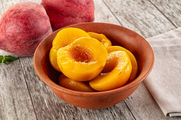 Sweet ripe yellow canned peaches