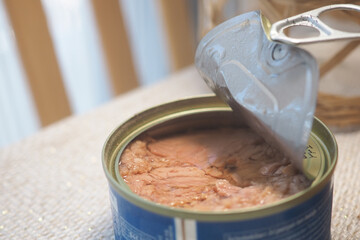 Opened tuna can on a kitchen surface