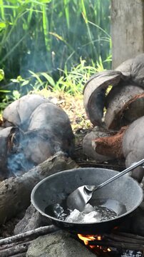 Cooking mie nyemek in a rice field with traditional outdoor style and rustic countryside atmosphere. Indonesian noodle dish prepared in a natural rural environment, showcasing local culinary culture, 