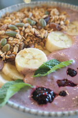 Delicious smoothie bowl topped with fresh fruits and granola