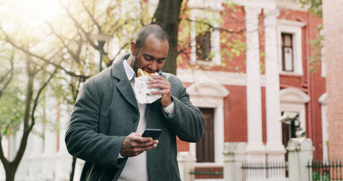 Man, phone and eating food for travel in city, browsing social media and lunch break. Male person, walking and mobile app with healthy meal, direction search and notification update for urban trip