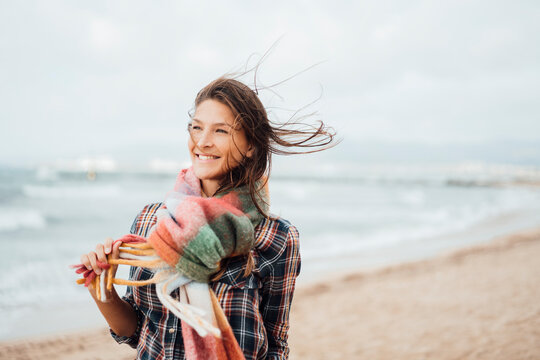 Happy woman spending leisure time at beach