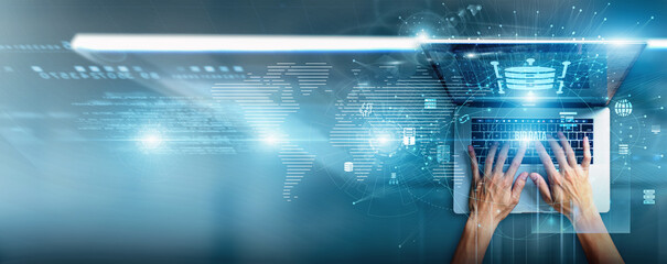 Data scientist using a laptop with big data analytics processing information, predictive modeling,...