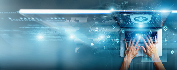 Insurance analyst using a laptop with InsurTech data policy automation, claim processing, digital underwriting, AI-driven risk scoring, fraud detection, and customer personalization.