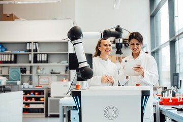 Scientists using AI-supported robot for medical research in laboratory