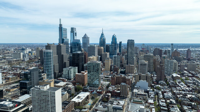Aerial view of a cityscape punctuated by towering skyscrapers like the Comcast Center and One Liberty Place, Philadelphia, Pennsylvania, United States.