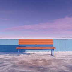 Empty orange bench on a snowy, vibrant blue and pink landscape