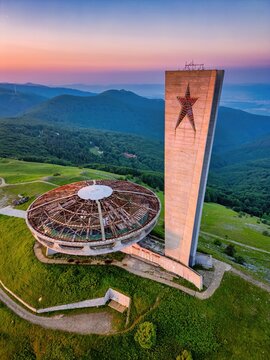 Buzludzha Monument drone view of the mountains at sunset in Bulgaria
