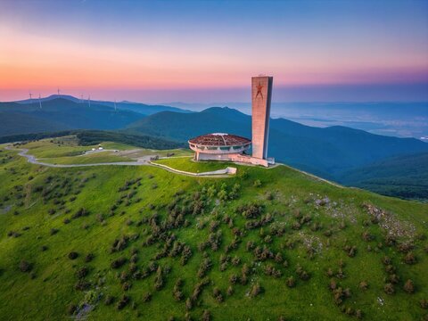 Buzludzha Monument drone view of the mountains at sunset in Bulgaria