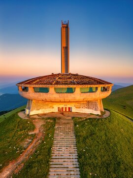 Buzludzha Monument drone view of the mountains at sunset in Bulgaria