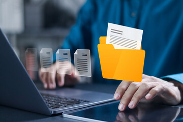 Corporate data management system concept. Businessman using laptop with digital data storage technology document file.