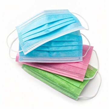 Stack of Colorful Disposable Face Masks Isolated