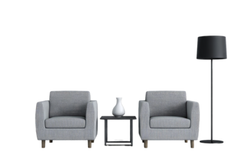 Gray armchairs, small table, and lamp in a minimalist setting