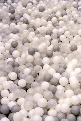 White and Gray Plastic Balls in Kids Ball Pit. Play and Fun Concept