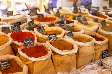 Colorful spices for sale at the market in Nyons, France