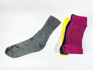 Colorful Socks Stacked on White Background
