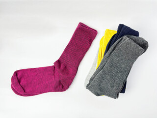 Colorful Socks Stacked on White Background