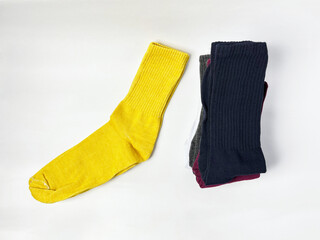 Colorful Socks Stacked on White Background