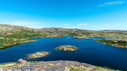 Obraz premium landscape Russian North view in the tundra with a mountain river and a lake in the mountains