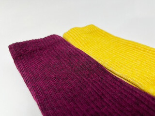 Close-up of maroon and yellow socks