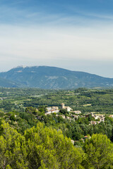 Fototapeta premium Vinsobres village nestled in the Drome Valley with Mont Ventoux dominating the landscape
