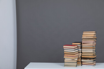 Stacks of old books to study in the library as the background of the university