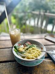 Bowl of Noodle with Egg and Iced Coffee