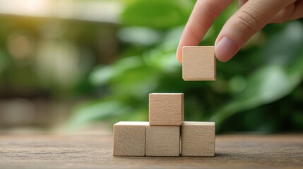 Wooden blocks stacking growth concept