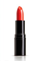 Close-up of a bright coral lipstick in a black tube