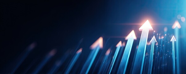 Abstract graphic of multiple upward-pointing arrows against a dark background, suggesting growth and progress