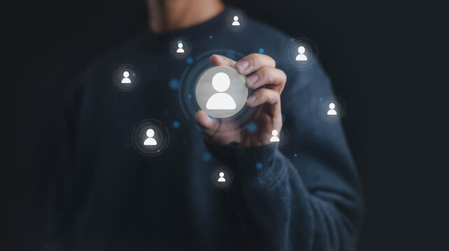 Businessman hand selecting user icon from digital network, concept of customer relationship management, recruitment, social connection, online community, HR, leadership, marketing and business 