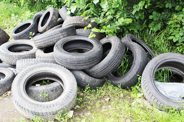 A dump of old car tires. The problem of recycling car tires