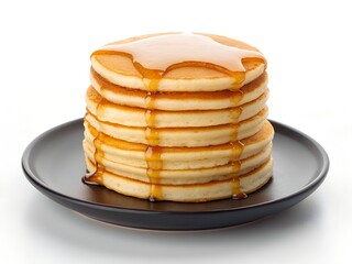 Stack of golden brown pancakes drizzled with syrup on a dark plate