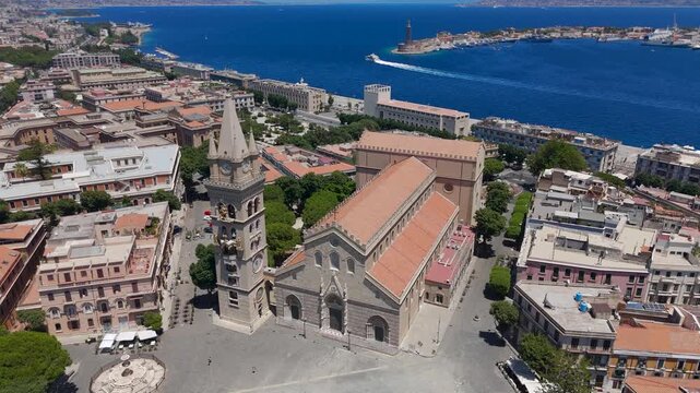 Aerial Drone Shot Flying Over Archdiocese Of Messina Church And City Towards The Sea In Messina, Sicily, Italy On A Bright Summer Day.