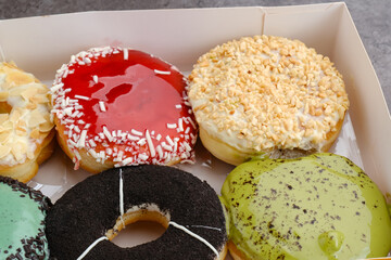 Glazed and decorated donuts, a variety of colorful donuts
