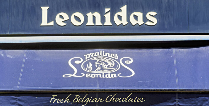 Lille, France - july 12, 2025 ; logo and signs on storefront signage of Leonidas, a renowned Belgian chocolate brand, with elegant branding elements and visual emphasis on pralines and fresh chocolate