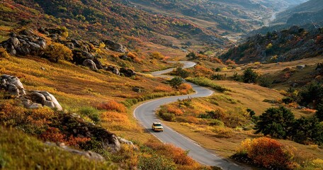 A curving road amid colorful autumn hills with a car traveling. Suitable for fall scenery, road trips, and nature travel visuals.