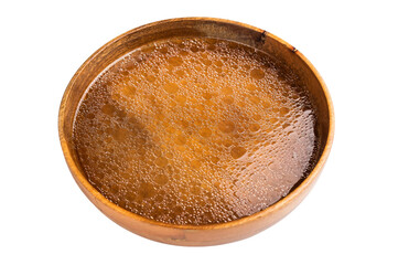 Chicken Bouillon or Broth  in a wooden plate isolated on white background. top view