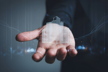 Businessman presenting a modern city model in his hand with digital technology