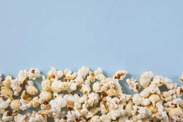 Popcorn isolated on blue background